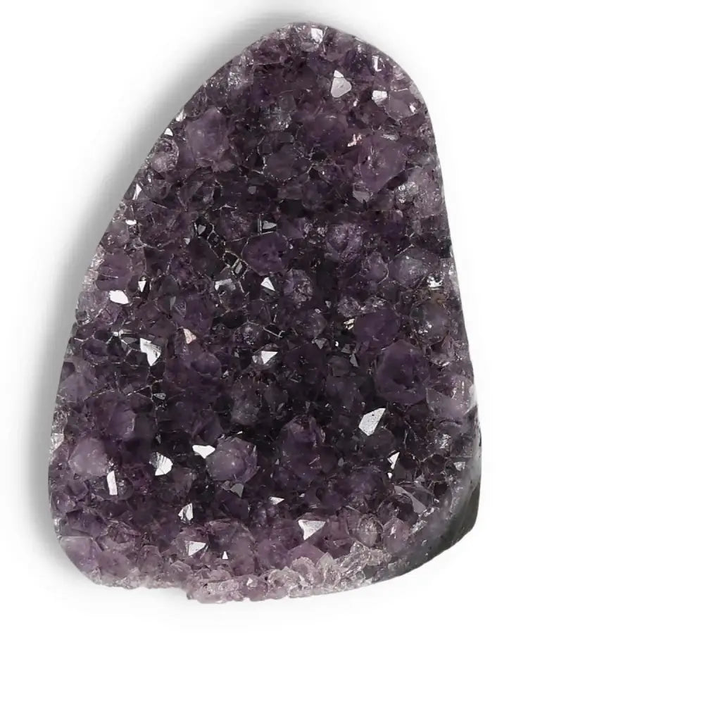 Amethyst cut base geode from Sylvia Crystals, showcasing deep purple tones and luxury craftsmanship for tranquil, positive energy.