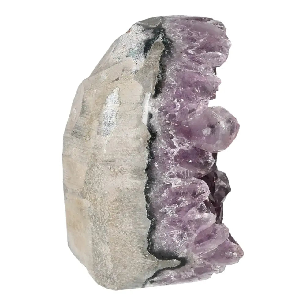 Amethyst cut base geode displaying natural crystal formations from Sylvia Crystals, highlighting unique spiritual and aesthetic qualities.