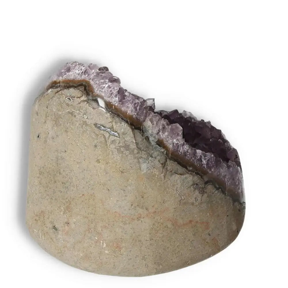 Amethyst cut base geode by Sylvia Crystals; a luxurious, stress-relieving gemstone with radiant purple tones for emotional stability.