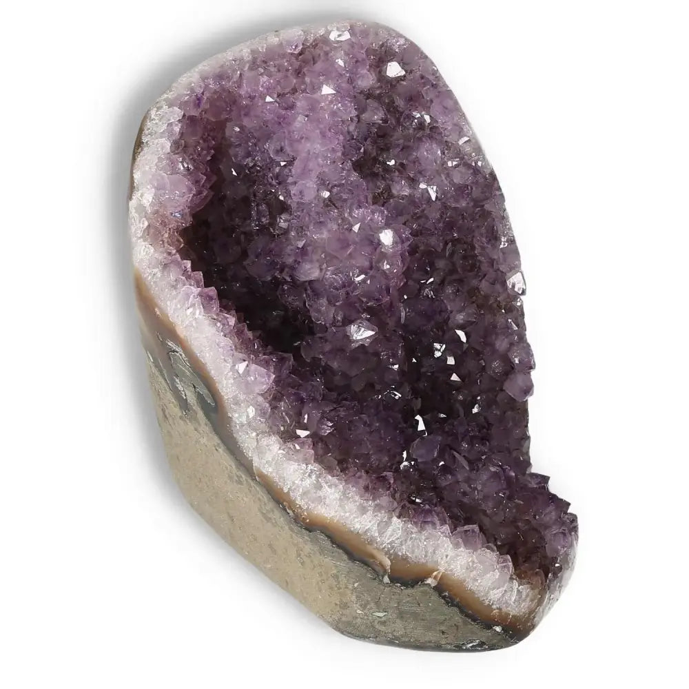 Amethyst cut base geode with vibrant purple crystals from Sylvia Crystals, renowned for stress relief and spiritual depth.
