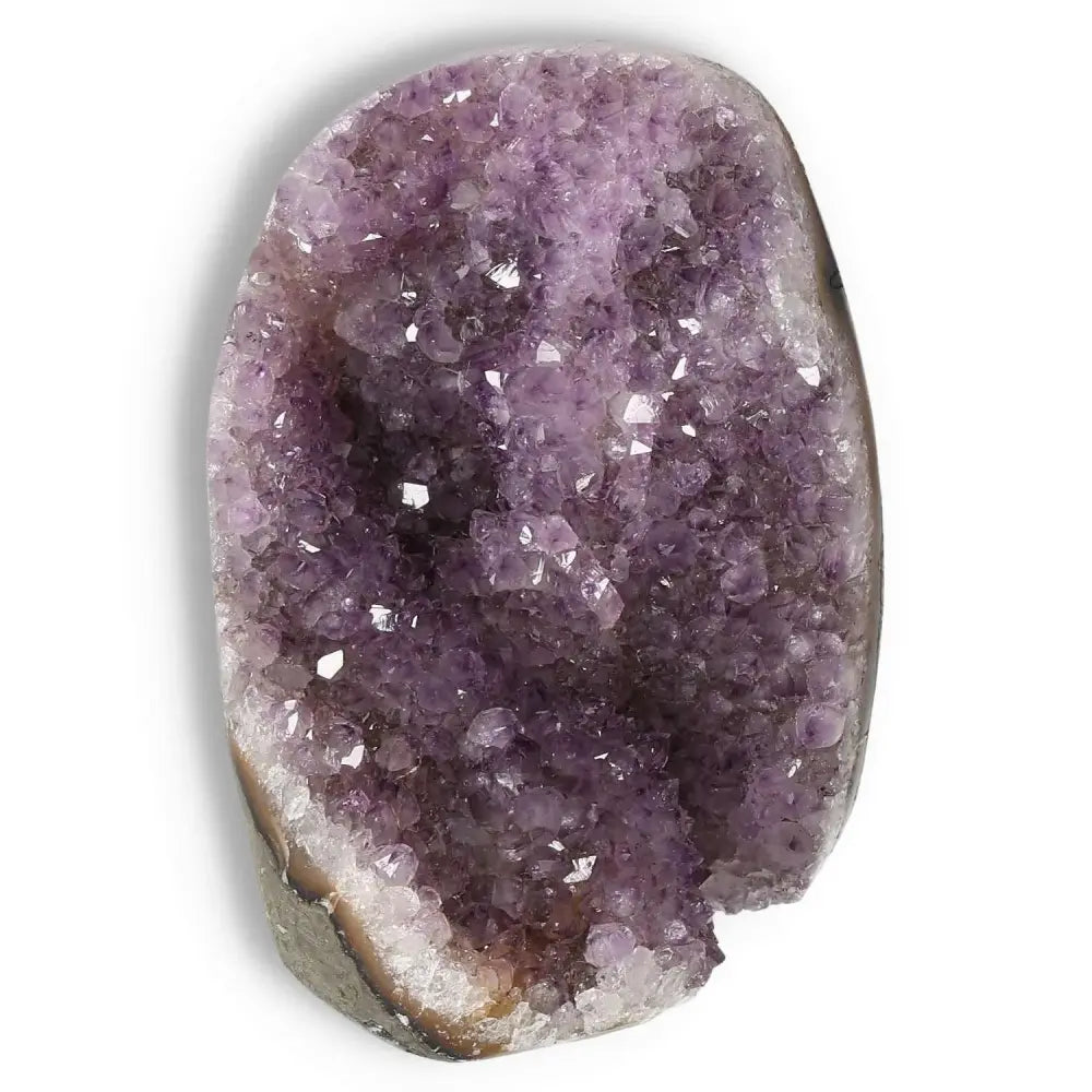 Amethyst cut base geode from Sylvia Crystals, showcasing natural beauty and spiritual depth with stress-relieving properties.
