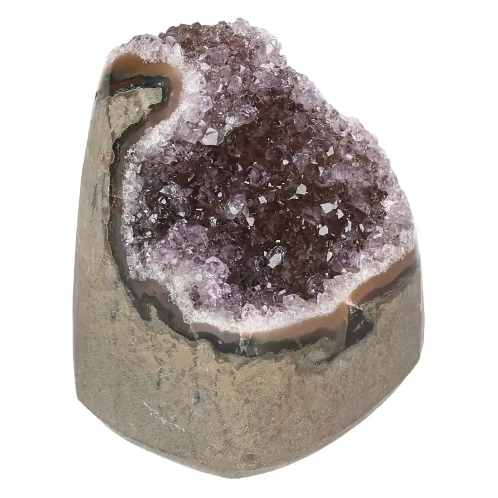 Stunning amethyst cut base geode with shimmering purple crystals, ideal as a decorative centerpiece and source of tranquility.