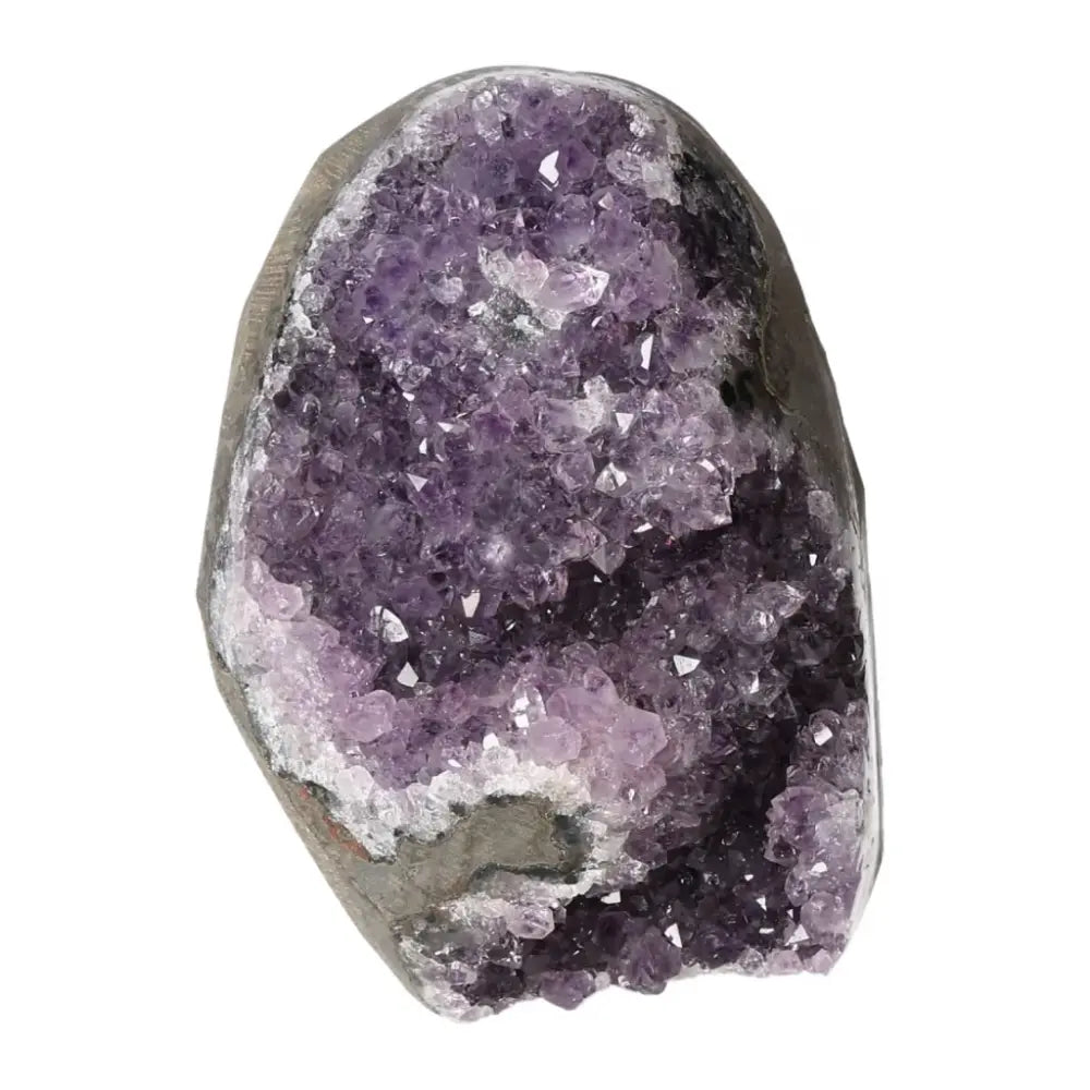Amethyst cut base geode from Sylvia Crystals, known for stress reduction and emotional stability, in a stunning purple crystal formation.