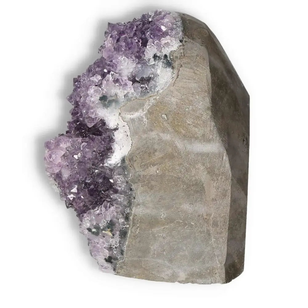 Amethyst cut base geode with vibrant purple crystals from Sylvia Crystals, known for stress reduction and enhancing mental wellness.