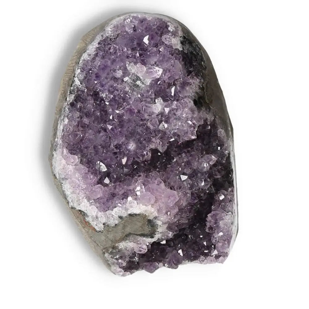 Amethyst cut base geode from Sylvia Crystals, enhancing mental wellness with stress reduction and emotional stability.