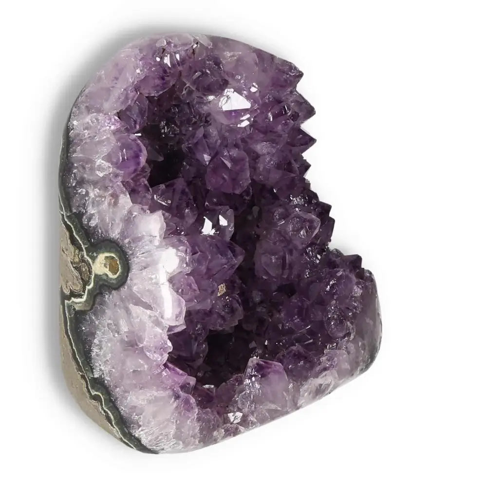 Amethyst cut base geode showcasing natural purple crystals, a premium piece by Sylvia Crystals, known for stress relief and aesthetic charm.