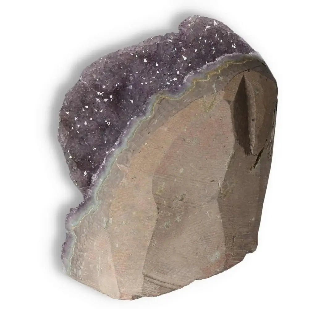 Premium Amethyst cut base geode showcased with vivid purple crystals, handpicked by Sylvia Crystals for stress relief and spiritual rejuvenation.