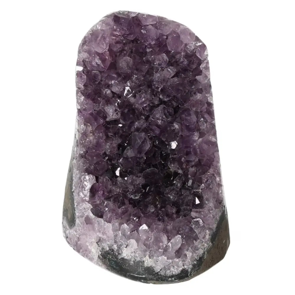 Amethyst cut base geode from Sylvia Crystals, displaying sparkling purple hues, ideal for stress relief and energy enhancement.