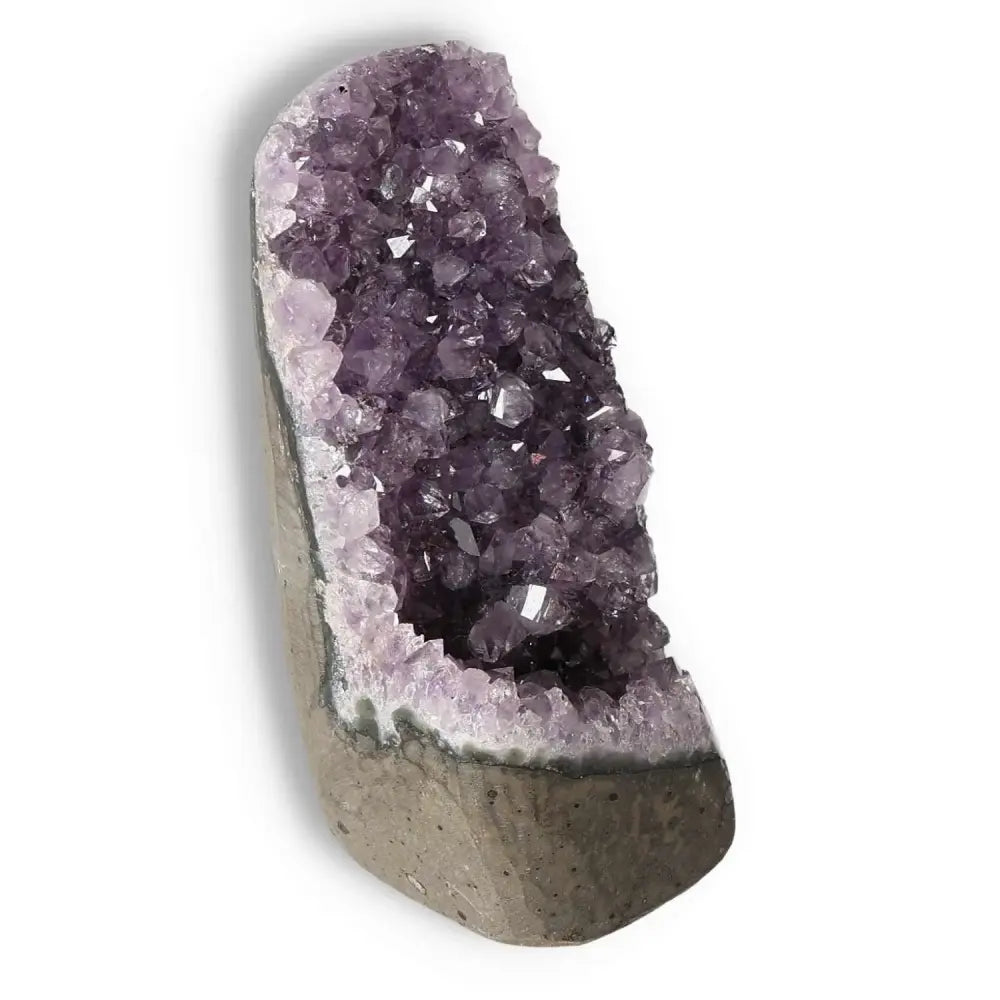 Amethyst cut base geode from Sylvia Crystals, showcasing quality cut and natural purple hues for stress relief and energy boost.