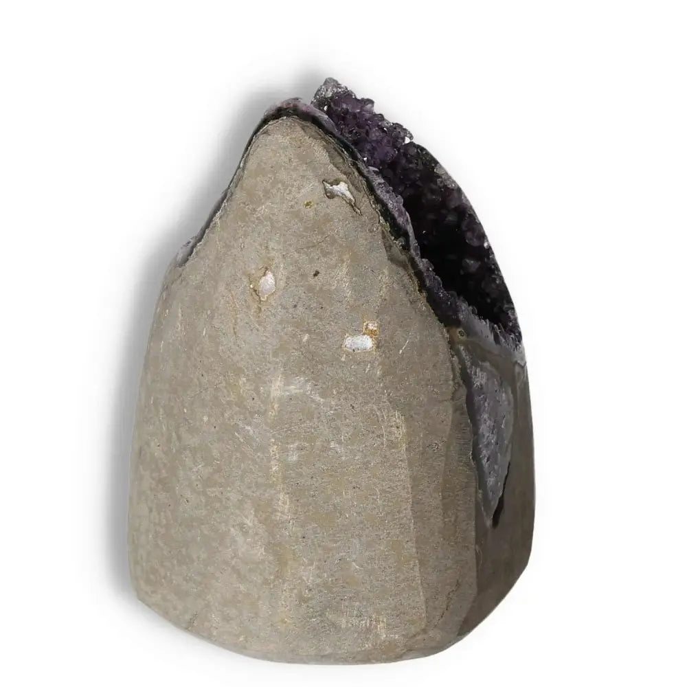 Amethyst cut base geode from Sylvia Crystals, known for reducing stress and enhancing concentration, displaying its natural beauty.