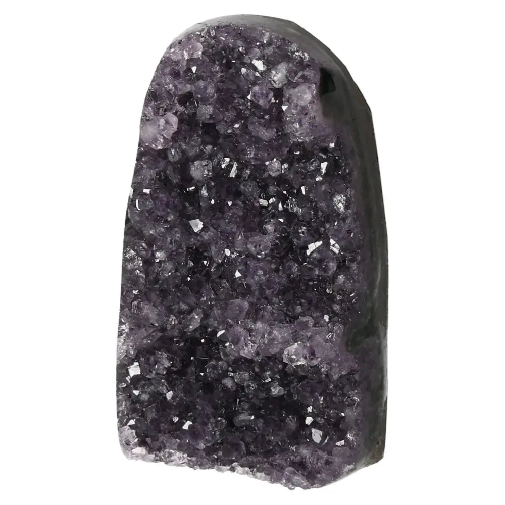 Amethyst geode from Sylvia Crystals showcasing vibrant purple crystals, known for stress reduction and concentration enhancement.