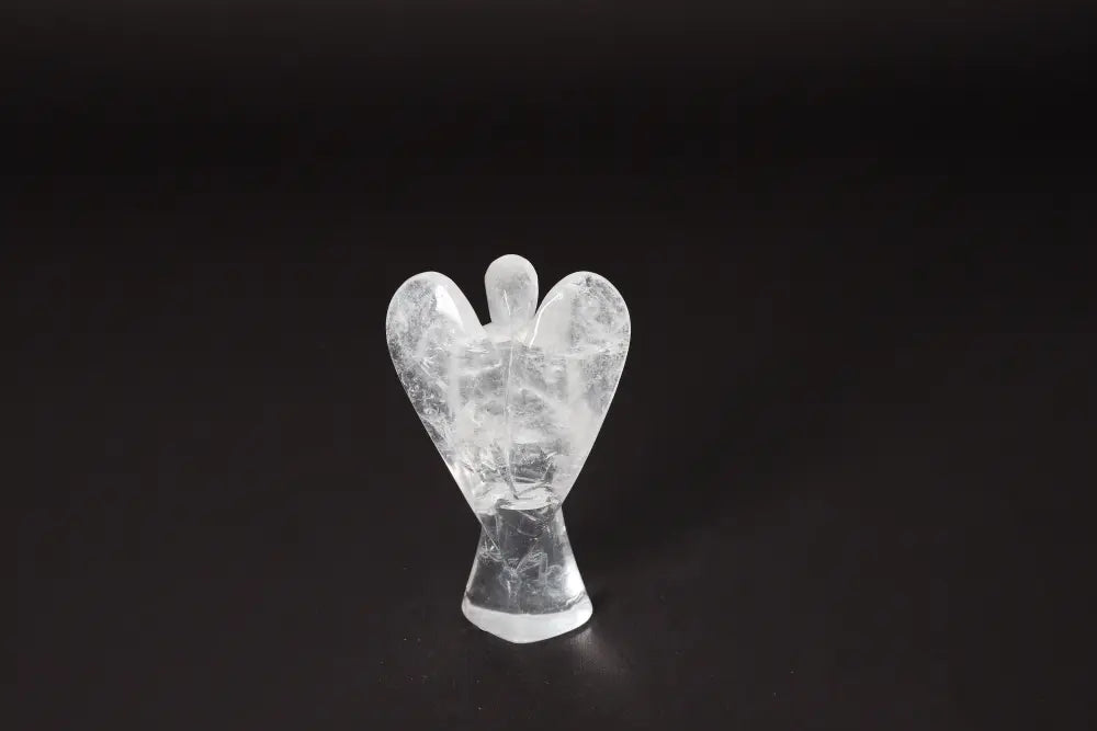 Angel Lemurian Quartz 11 cm figurine on a black background, known for stress reduction, energy boost, and enhancing concentration.