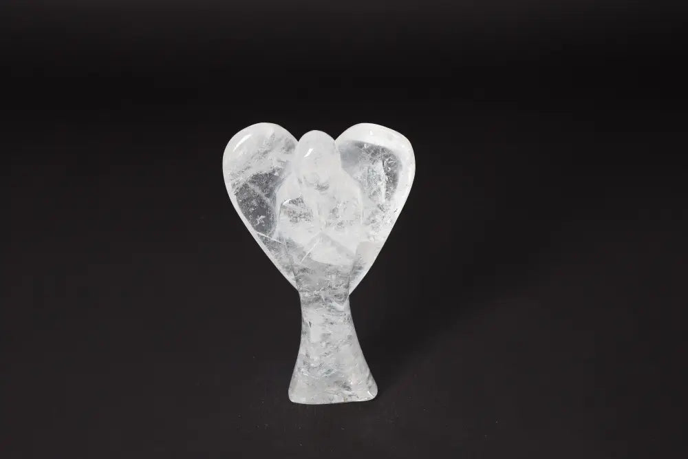 Angel Lemurian Quartz crystal sculpture on dark background, 13 cm tall, known for stress reduction, energy boost, and emotional stability.