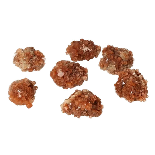 Cluster of aragonite druzy stones in warm amber tones, known for grounding and balancing energy, ideal for collectors and tranquil spaces.