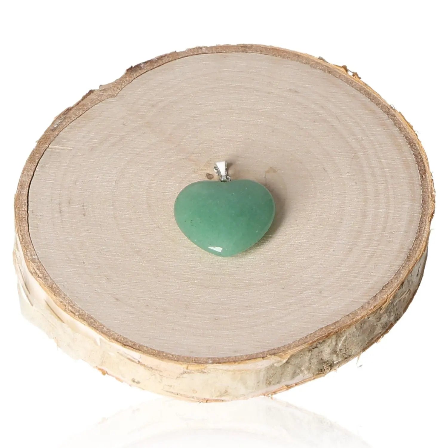 Aventurine Heart Pendant 20mm on wooden disk, highlighting its genuine gemstone allure and sophistication.