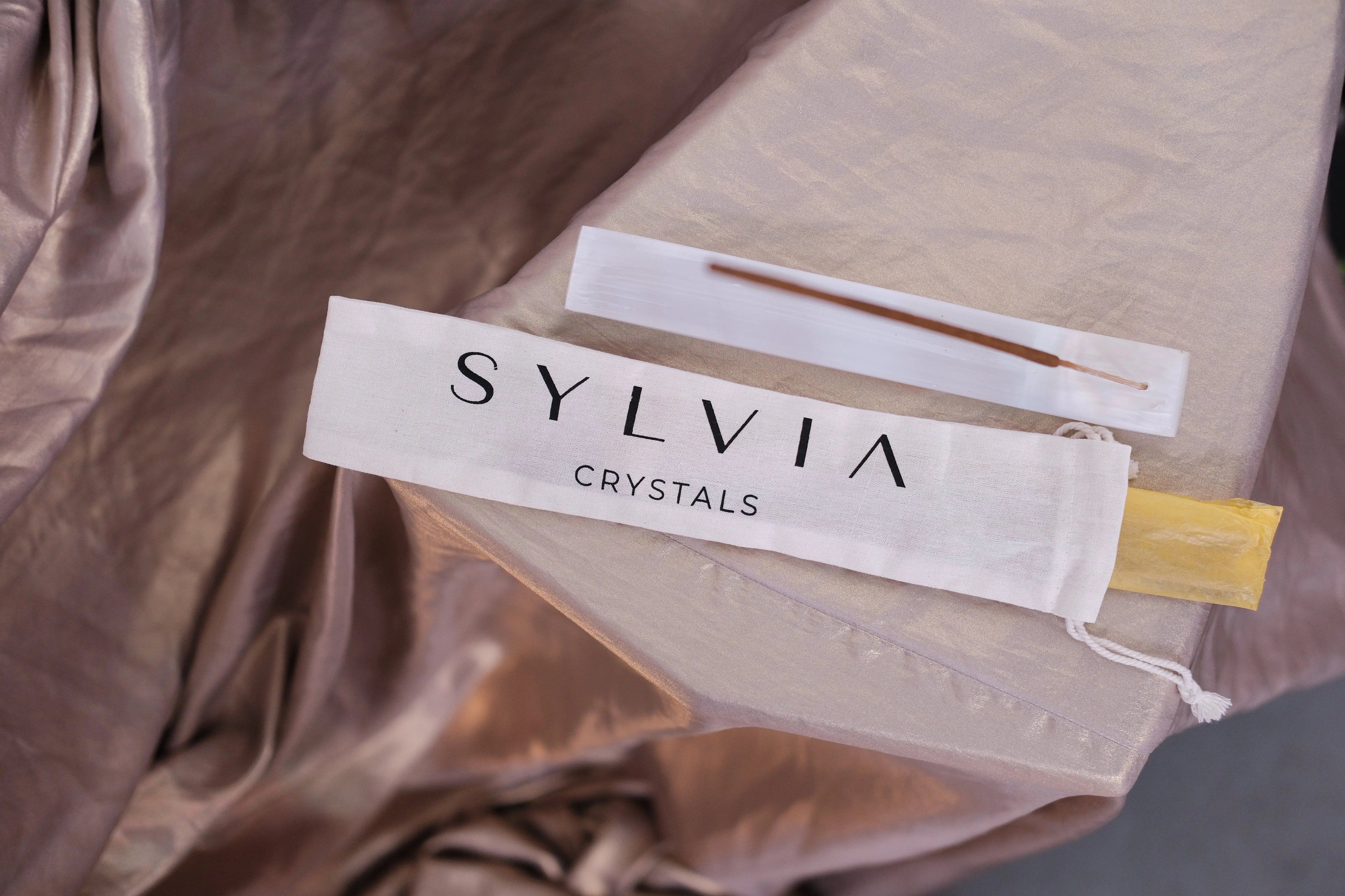 Elegant Bali Harmony Incense Blend on luxurious fabric, featuring hand-rolled incense sticks for balance, serenity, and aromatherapy.