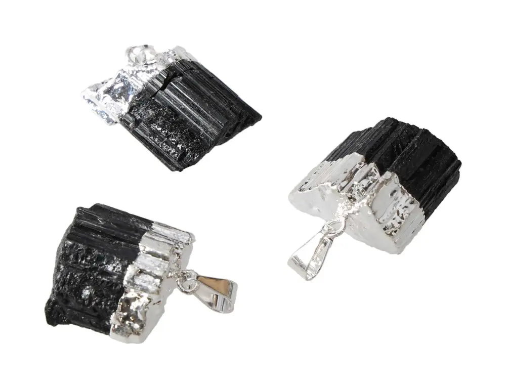 Black Tourmaline Pendants in silver setting, featuring raw black crystals, perfect for jewelry lovers and collectors of unique gemstones.