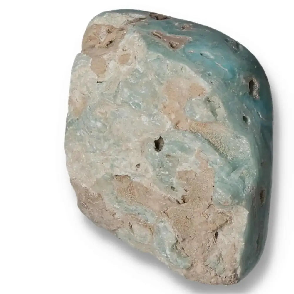 Rough blue aragonite crystal from Pakistan, showcasing natural blue and beige hues, promoting tranquility and balance.