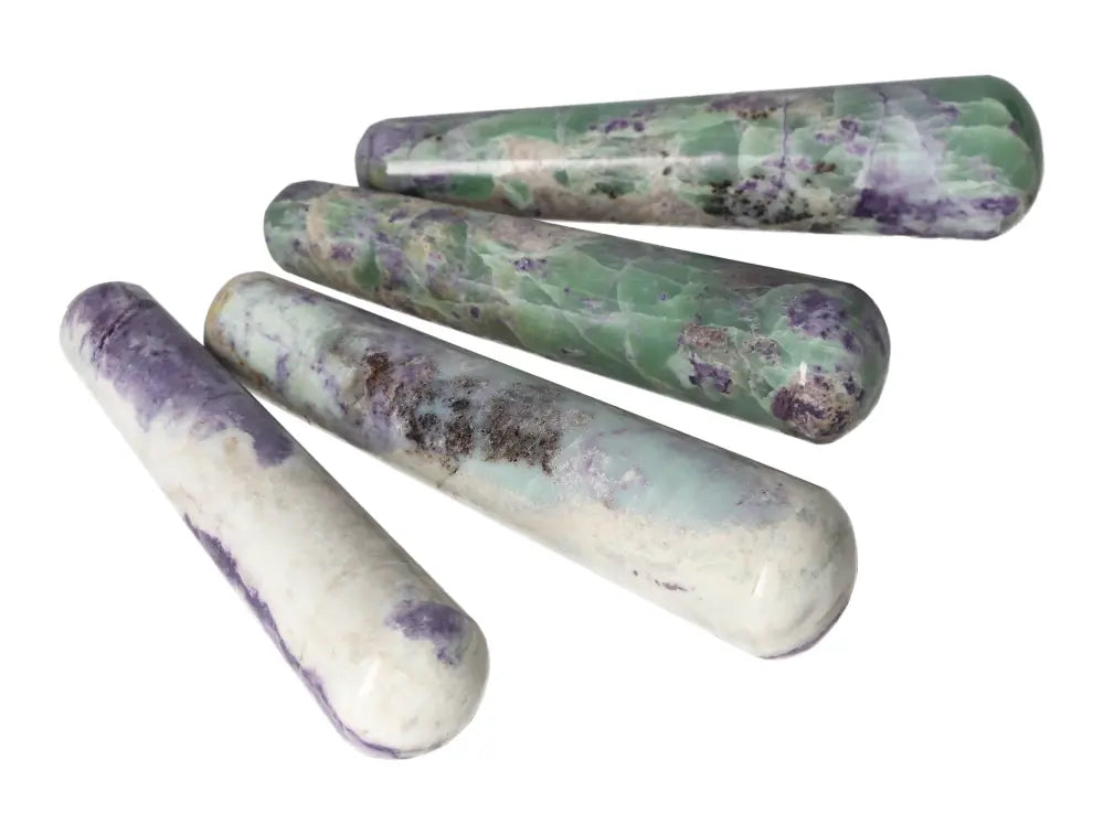 Set of four Bolivianite wands displaying unique purple and green mineral patterns for crystal healing and energy work.