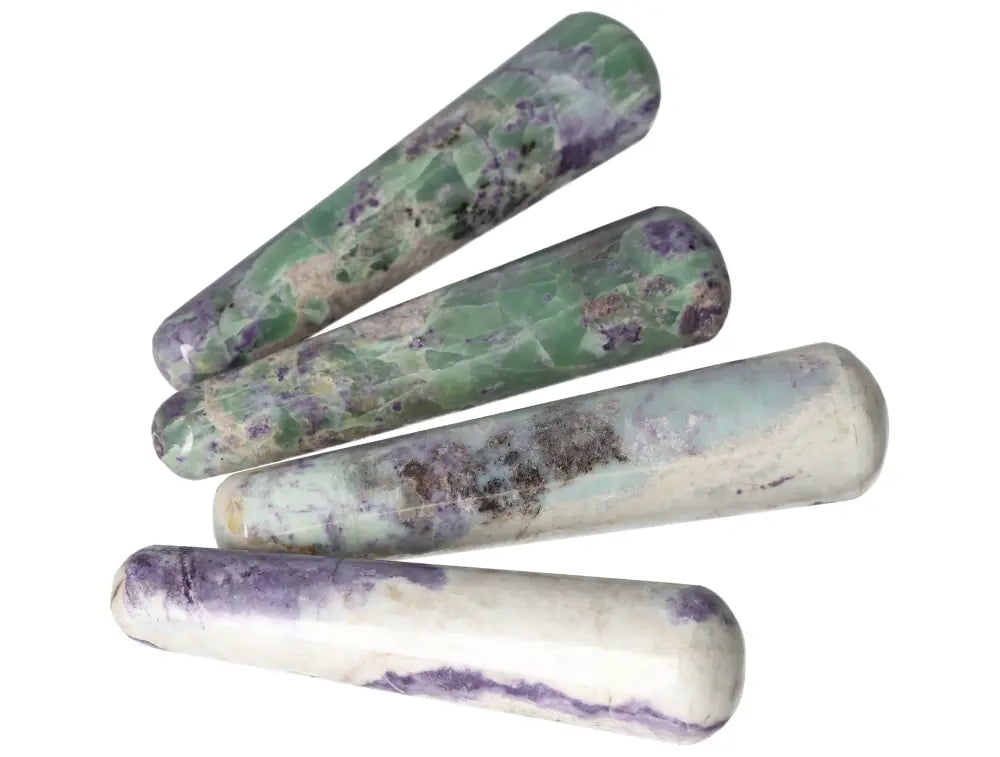 Four polished Bolivianite wands displaying rich green and purple hues, perfect for crystal healing and meditation practices.