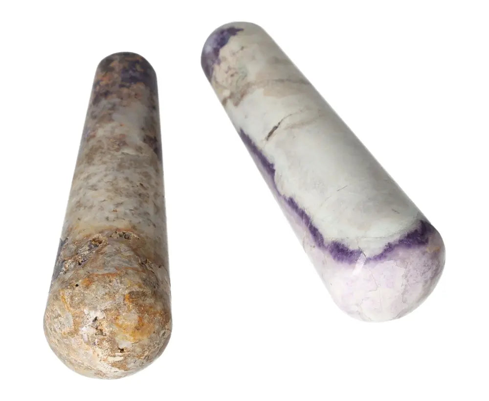 Two polished Bolivianite wands showcasing natural purple and beige hues, perfect for crystal healing and energy work.