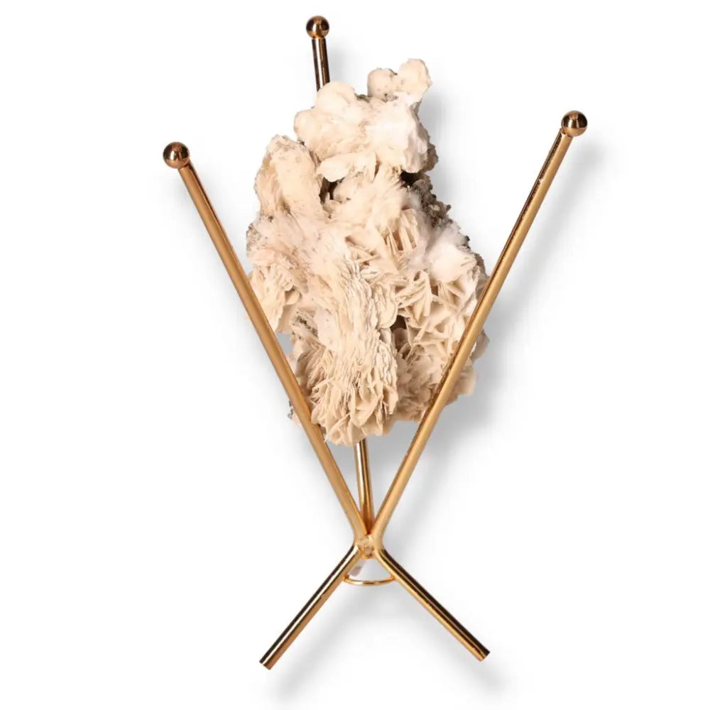 Premium Calcite crystal from Sylvia Crystals, displayed on a metal stand, enhancing room ambiance and promoting personal growth.