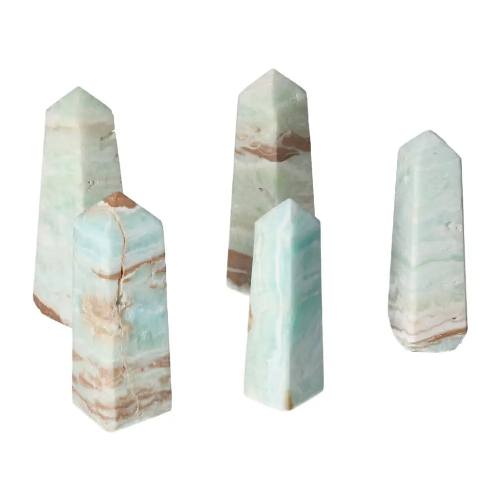 Caribbean Calcite towers from Sylvia Crystals featuring calming blue and white hues symbolizing peace and balance.