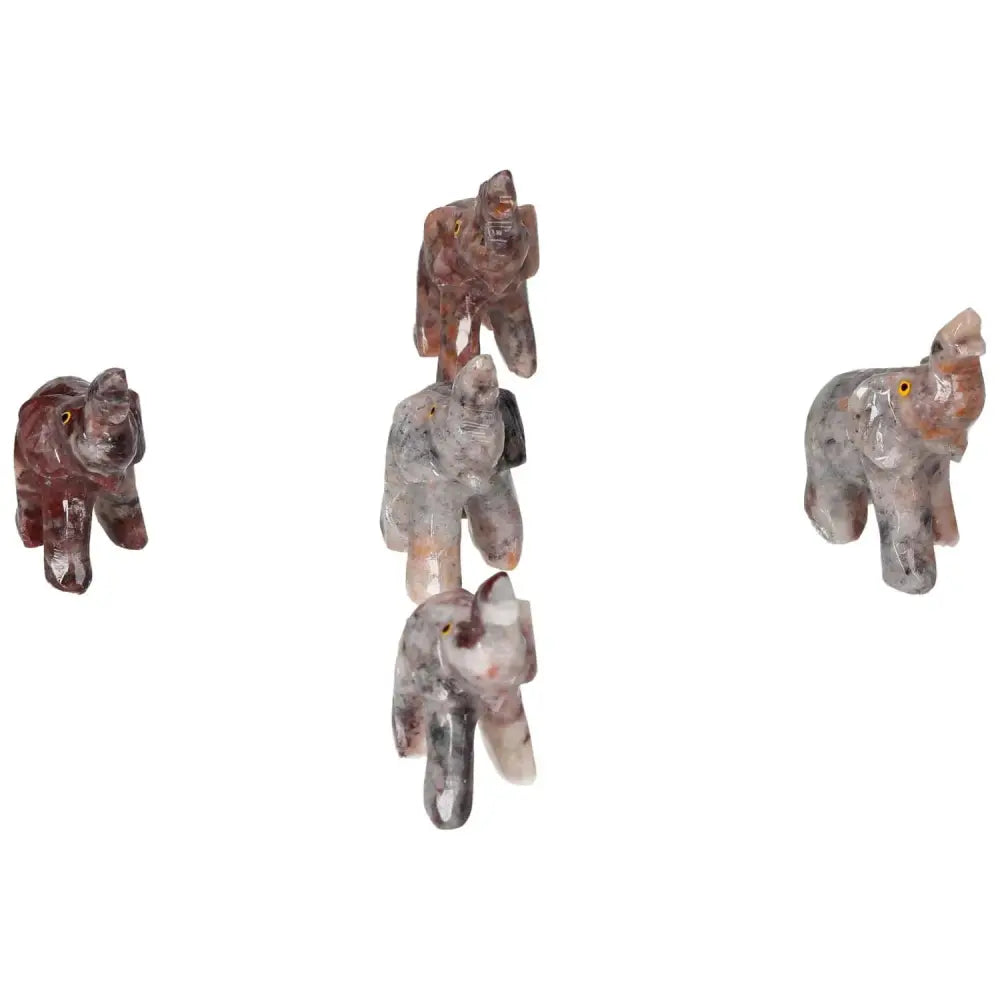 "Five carved crystal elephants made from high-quality magnesite, exemplifying Sylvia Crystals' luxurious spiritual art collection."