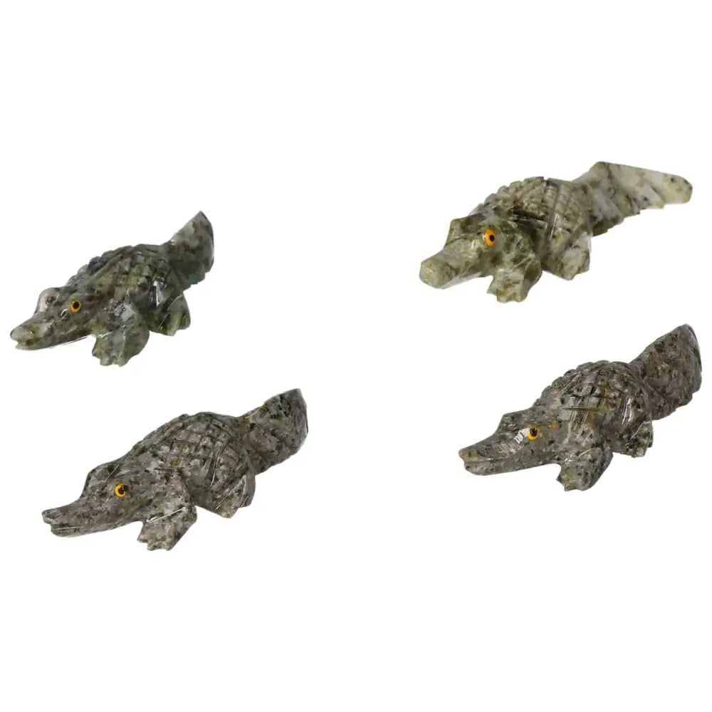 Carved Dolomite Alligator figurines by Sylvia Crystals, highlighting intricate craftsmanship and luxury design.