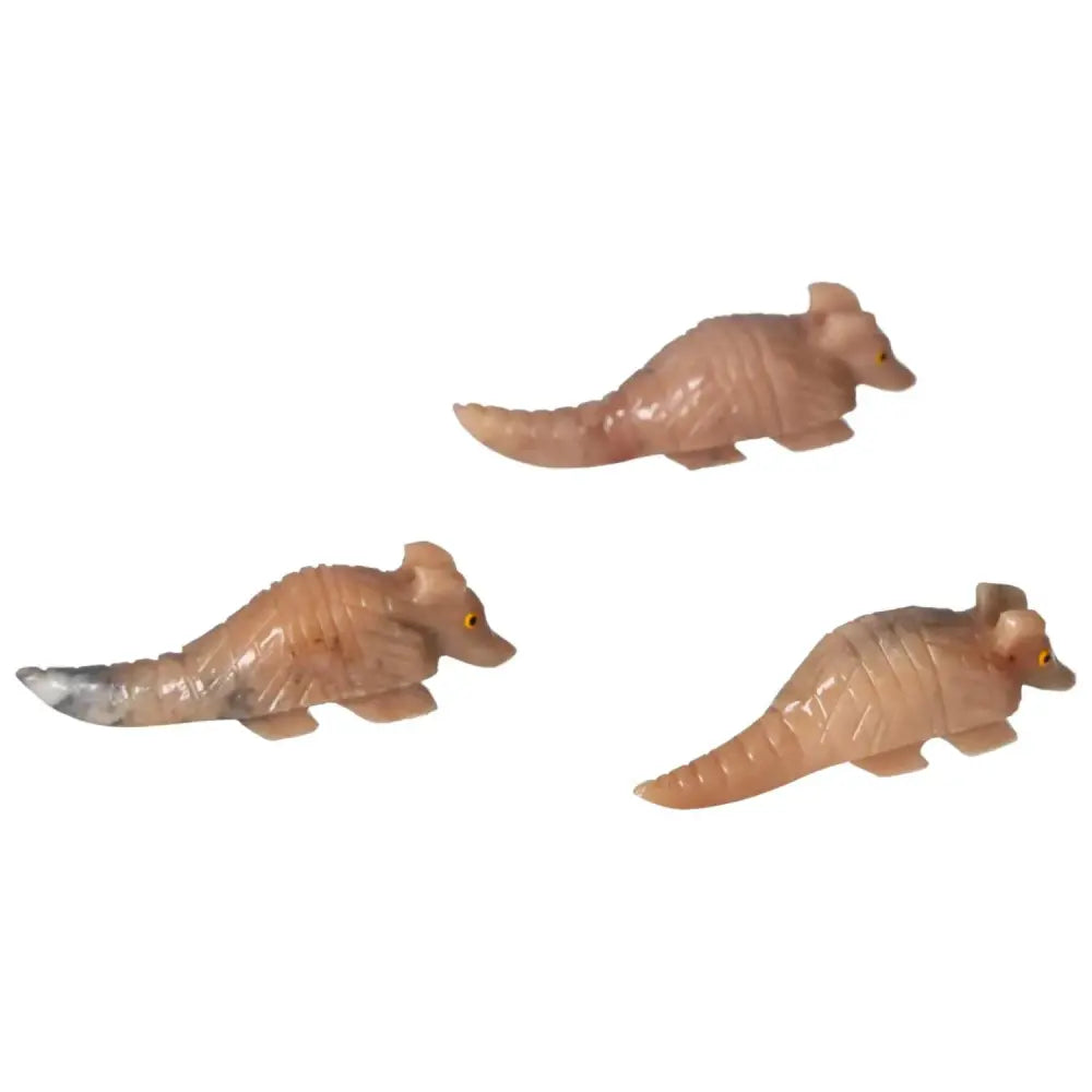 Carved Dolomite Armadillo figurines showcasing spiritual elegance and emotional healing properties by Sylvia Crystals.