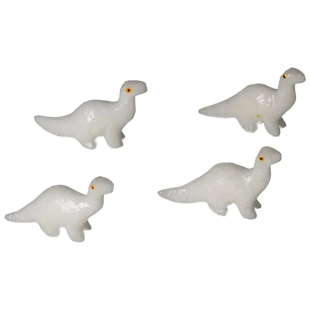 Carved Dolomite Dinosaur figurines in white, showcasing fine craftsmanship from Sylvia Crystals, promoting serenity and emotional balance.