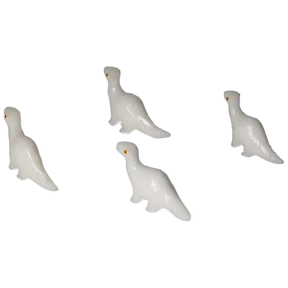 Carved Dolomite Dinosaur figures crafted by Sylvia Crystals, showcasing fine artistry and natural dolomite material.
