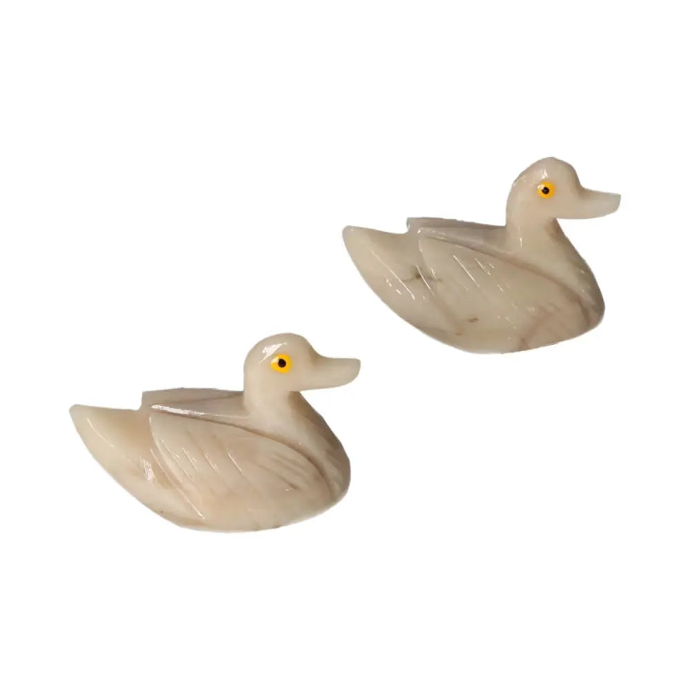 Carved Dolomite Duck figurines by Sylvia Crystals, showcasing natural artistry and calming properties, perfect for emotional balance.