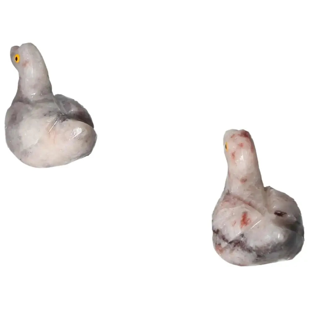 Carved Dolomite Duck figurines showcasing luxury and spiritual wellness by Sylvia Crystals. Hand-carved for emotional stability and serenity.