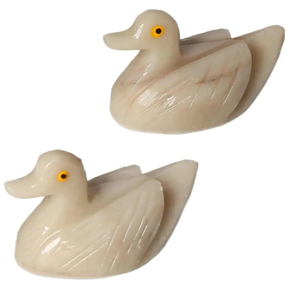 Pair of Carved Dolomite Ducks showcasing artisanal craftsmanship, embodying serenity and grounding properties.
