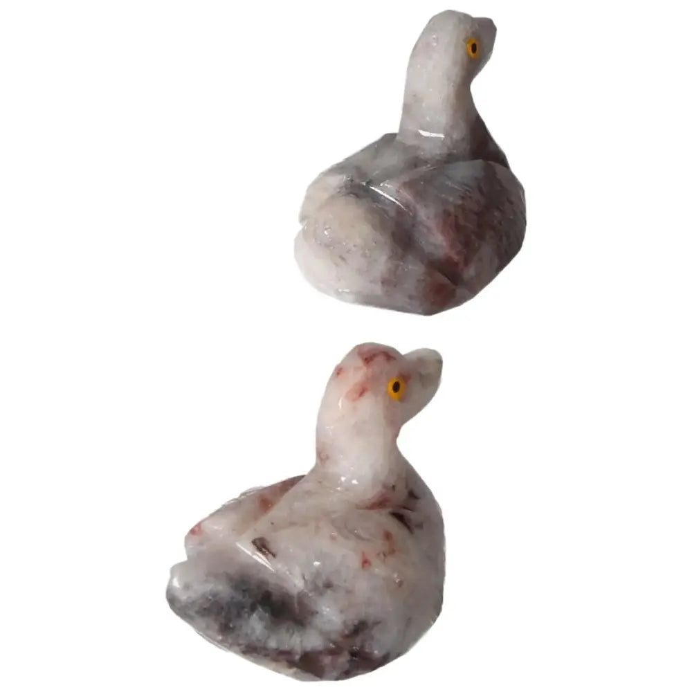 Two hand-carved dolomite ducks by Sylvia Crystals, showcasing luxury and spiritual wellness with calming properties.