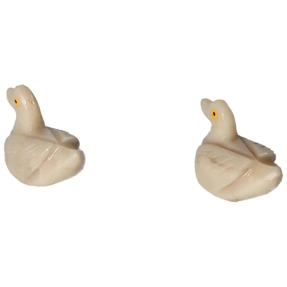 Hand-carved dolomite duck figurines showcasing exquisite artistry and natural beauty; perfect for collectors and home décor.