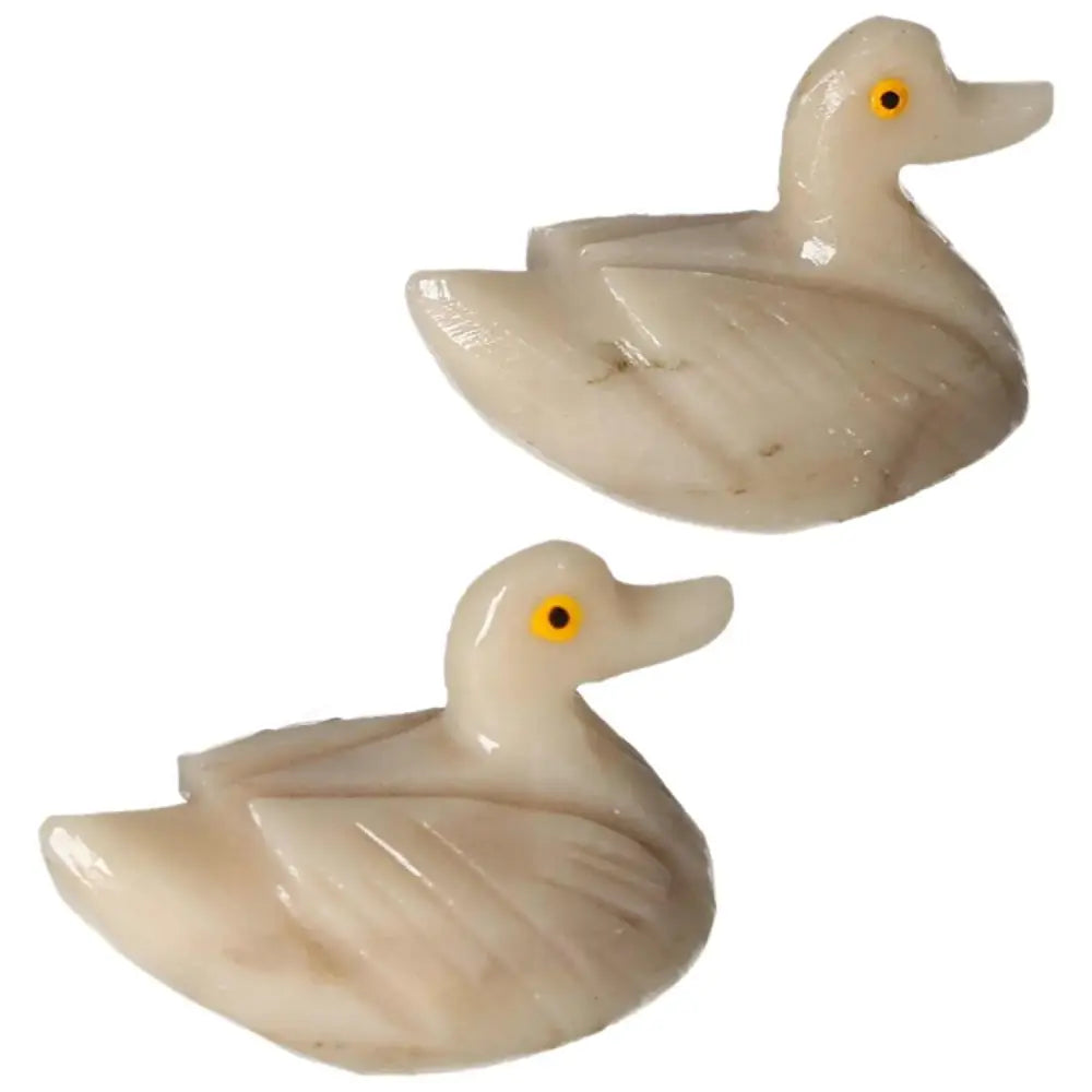 Pair of hand-carved dolomite ducks with intricate detailing, symbolizing tranquility and natural artistry, ideal for collectors.