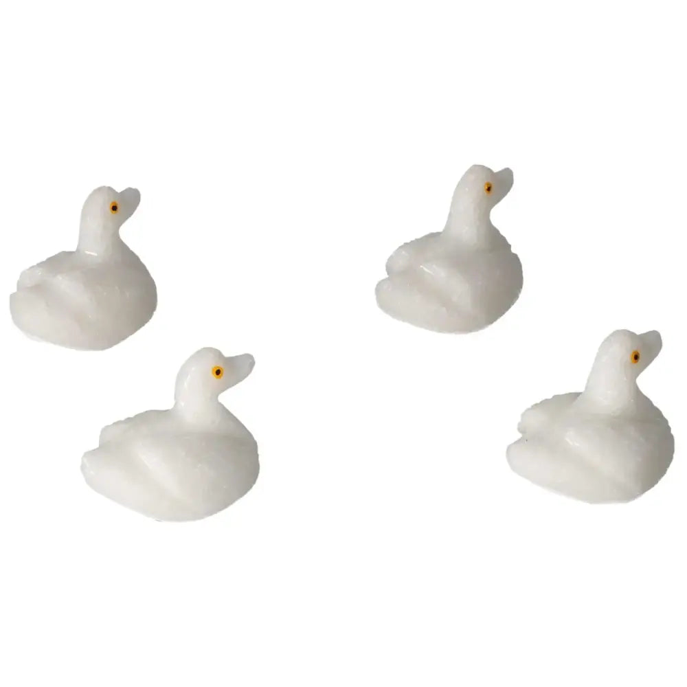 Collection of small carved dolomite duck figurines, ideal for decoration and emotional balance, enhancing a serene ambiance.