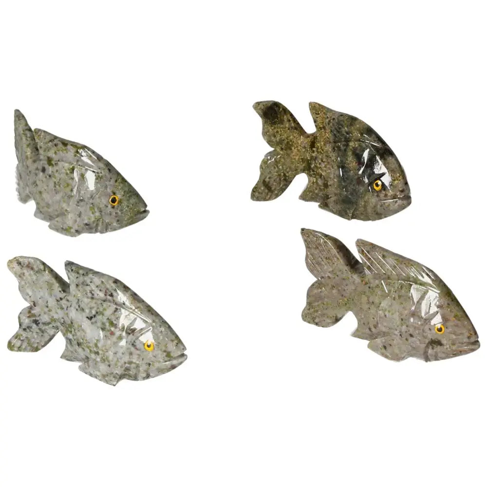Image of four intricately carved dolomite fish, showcasing detailed craftsmanship and natural dolomite textures for spiritual and emotional well-being.