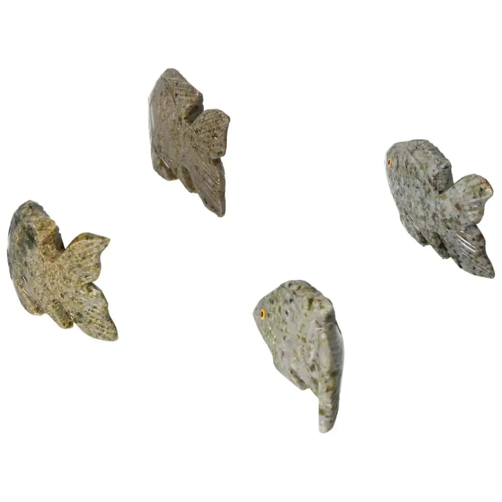 Carved Dolomite Fish by Sylvia Crystals showcasing intricate craftsmanship, promoting emotional well-being and spiritual luxury.