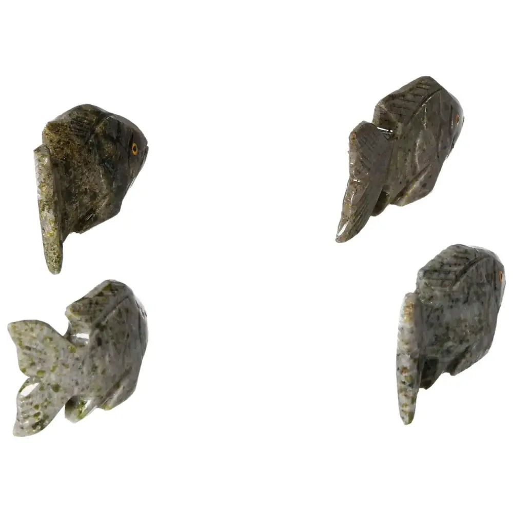Exquisite carved dolomite fish sculptures showcasing intricate design and grounding properties for emotional well-being.