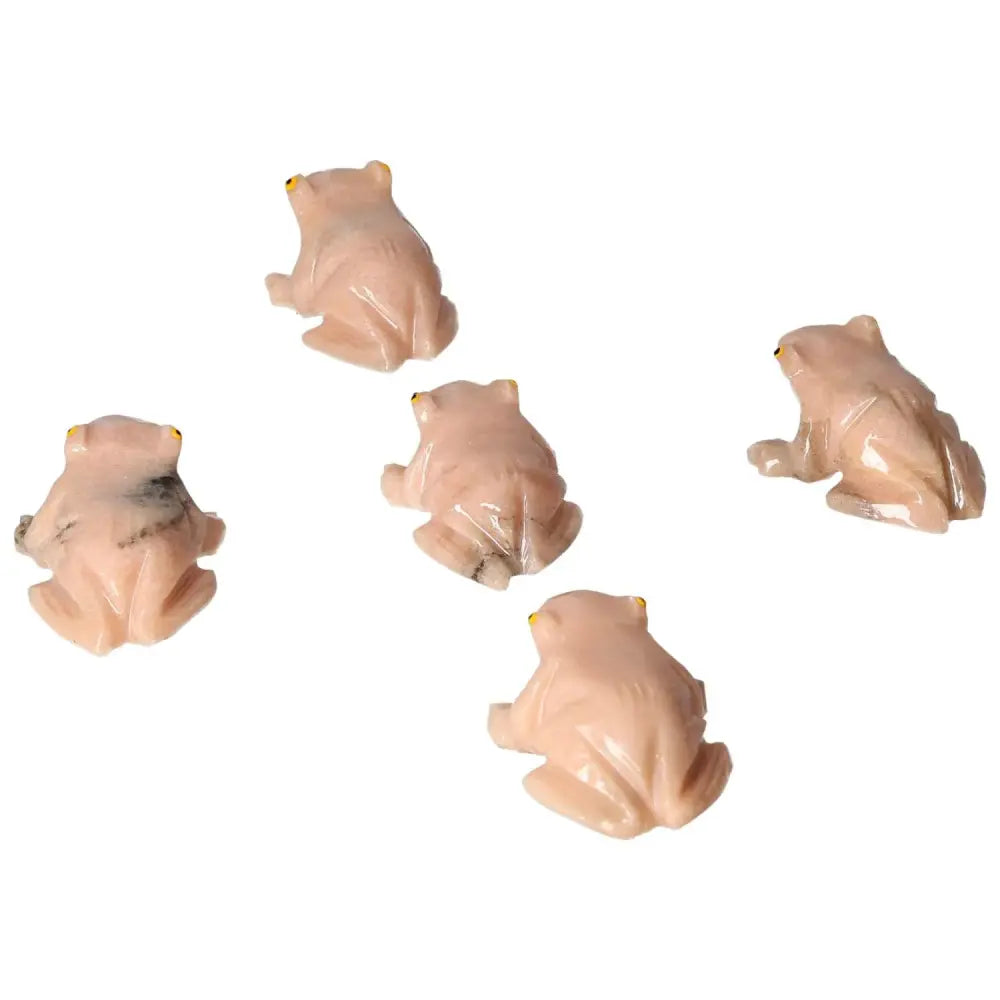 Collection of carved dolomite frog ornaments by Sylvia Crystals, symbolizing transformation and emotional balance.