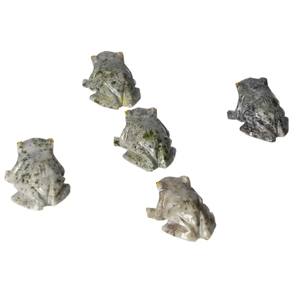 Five carved dolomite frog sculptures by Sylvia Crystals, showcasing elegant craftsmanship for tranquility and emotional balance.