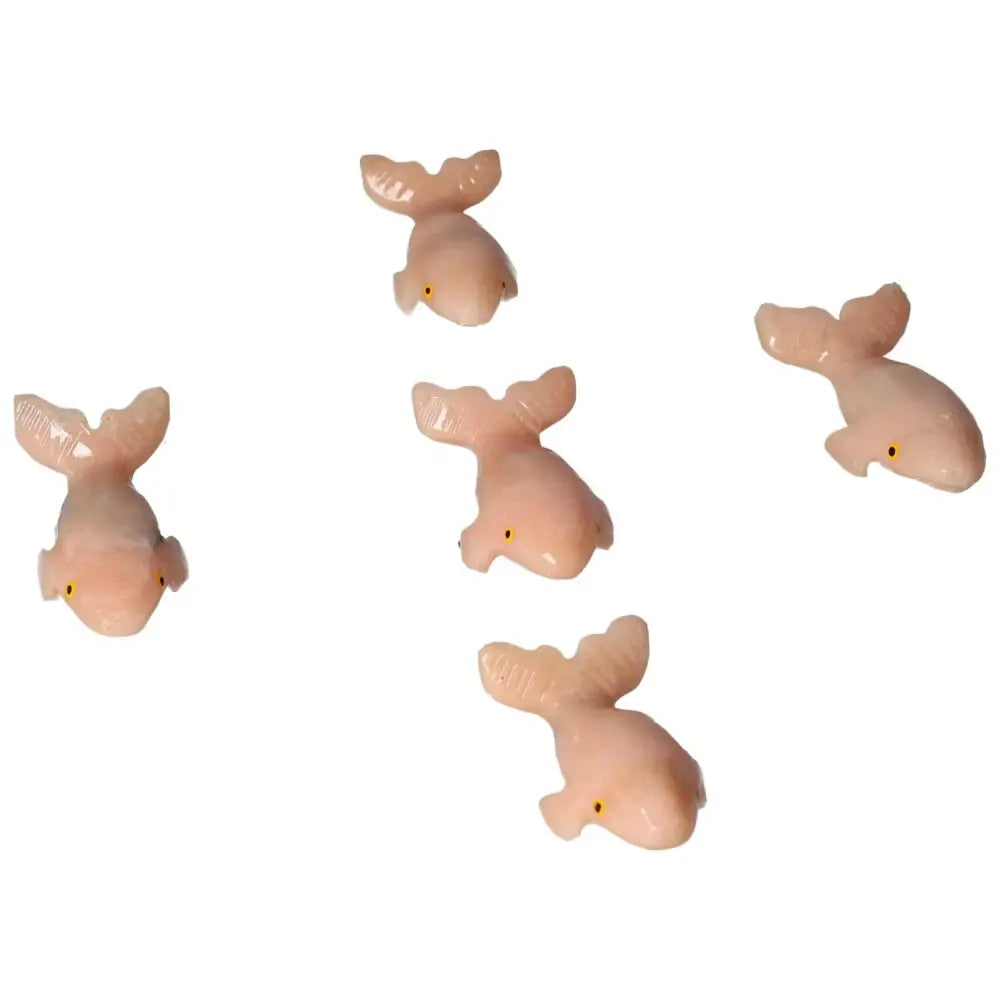 Elegant carved dolomite whale statues by Sylvia Crystals, perfect for home or office decor, symbolizing tranquility and natural beauty.