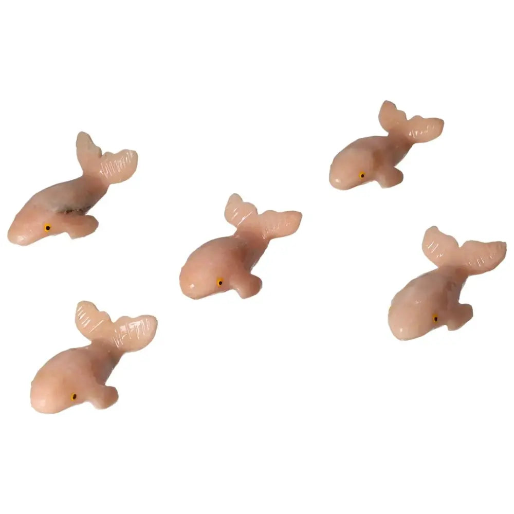 Set of carved dolomite whale figurines, perfect for home or office decor, symbolizing tranquility and elegance from Sylvia Crystals.