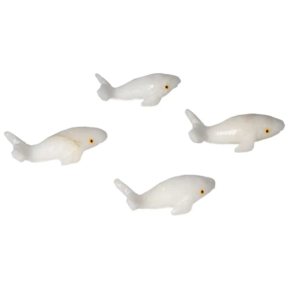 Carved Dolomite Whale figurines by Sylvia Crystals, symbolizing peace and balance, crafted from calming dolomite.