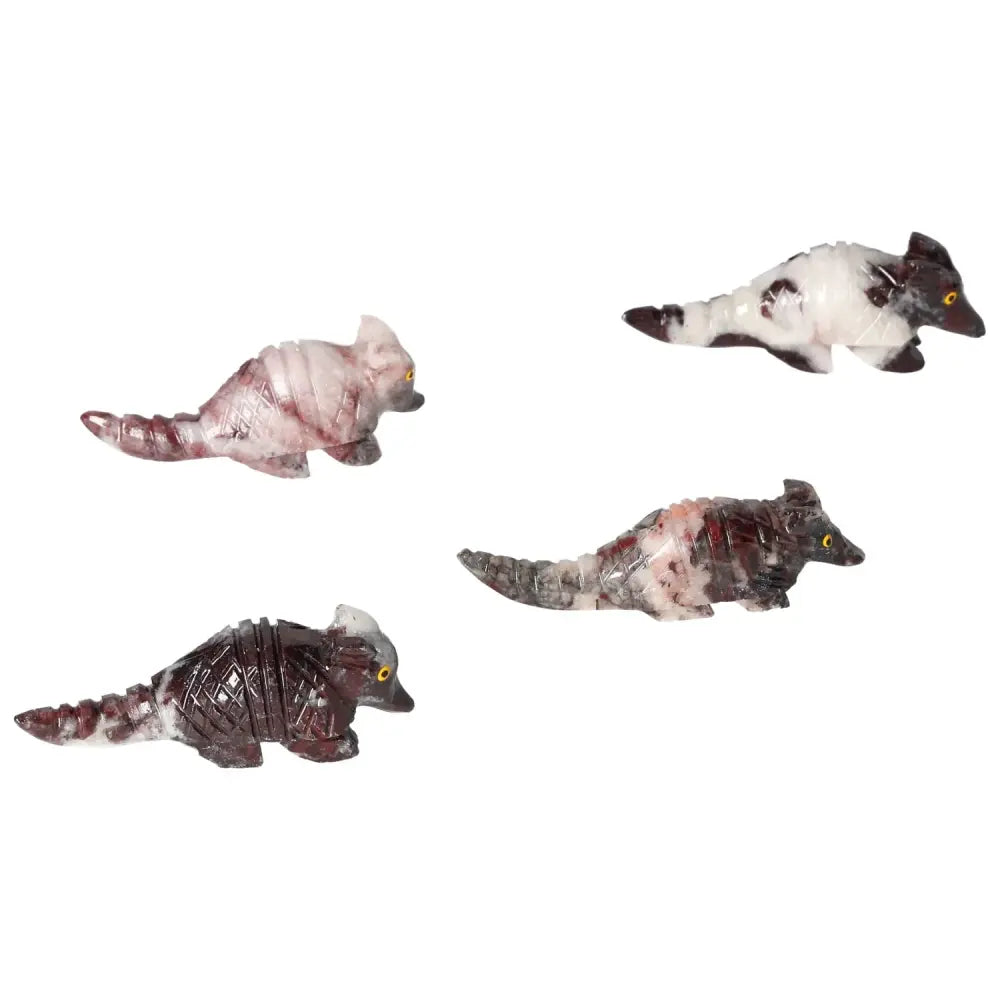 Four carved magnesite armadillo sculptures showcasing detailed craftsmanship and calming aesthetic, ideal for spiritual and decorative use.