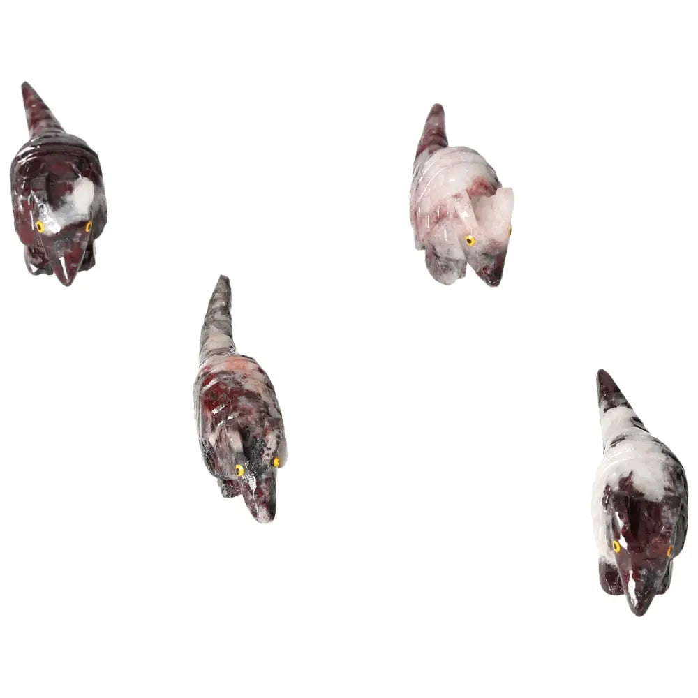 Carved magnesite armadillo sculptures displaying intricate details and vibrant colors, offering spiritual and decorative appeal.