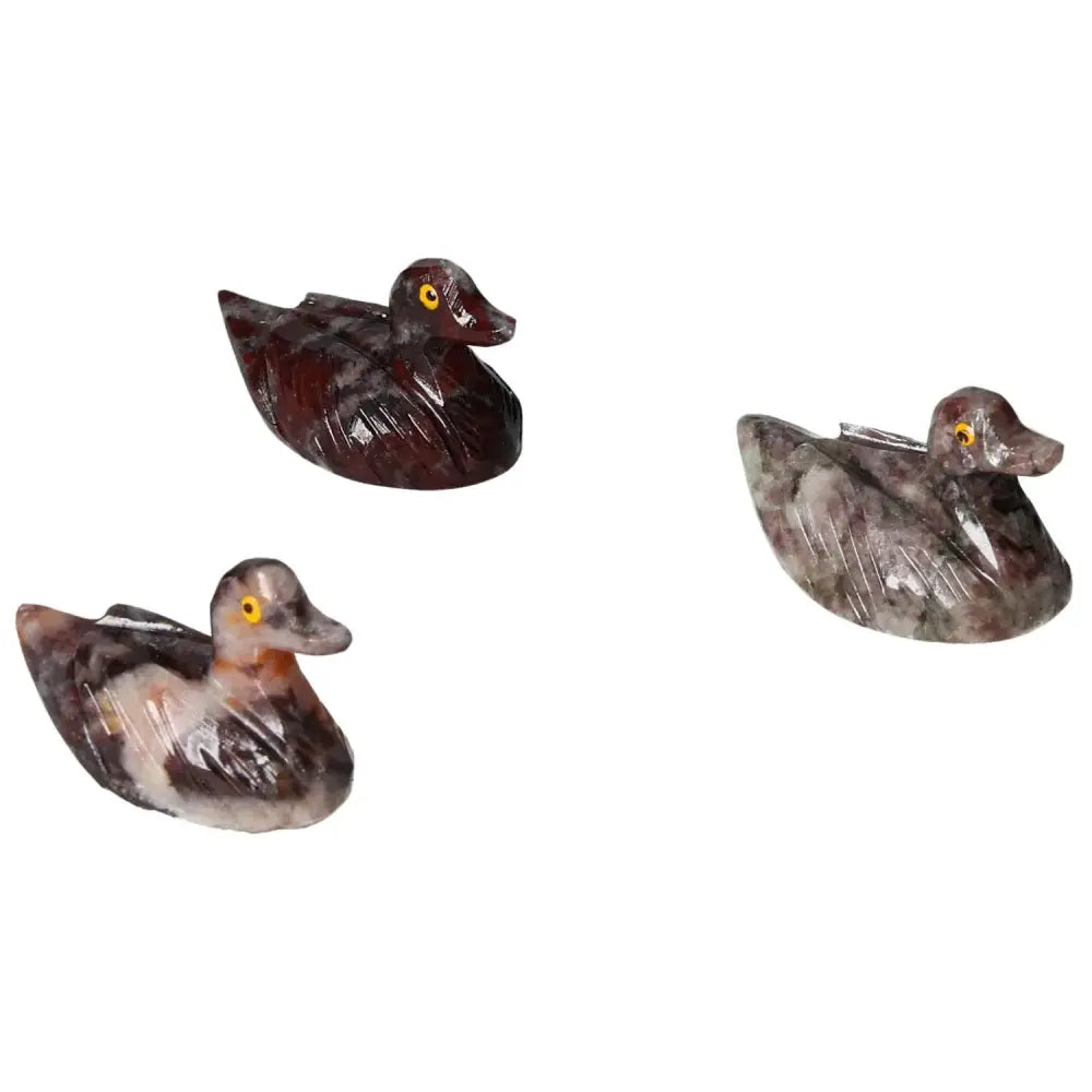 Carved magnesite duck sculptures showcasing intricate craftsmanship and serene elegance, perfect for meditation and home decor.